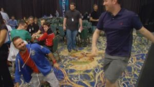 Negreanu gets tackled by Scott Seiver